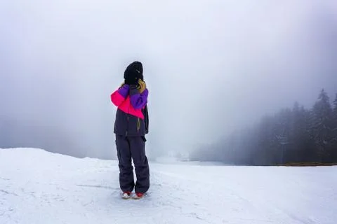 Young woman scared on top of the mountain Stock Photos