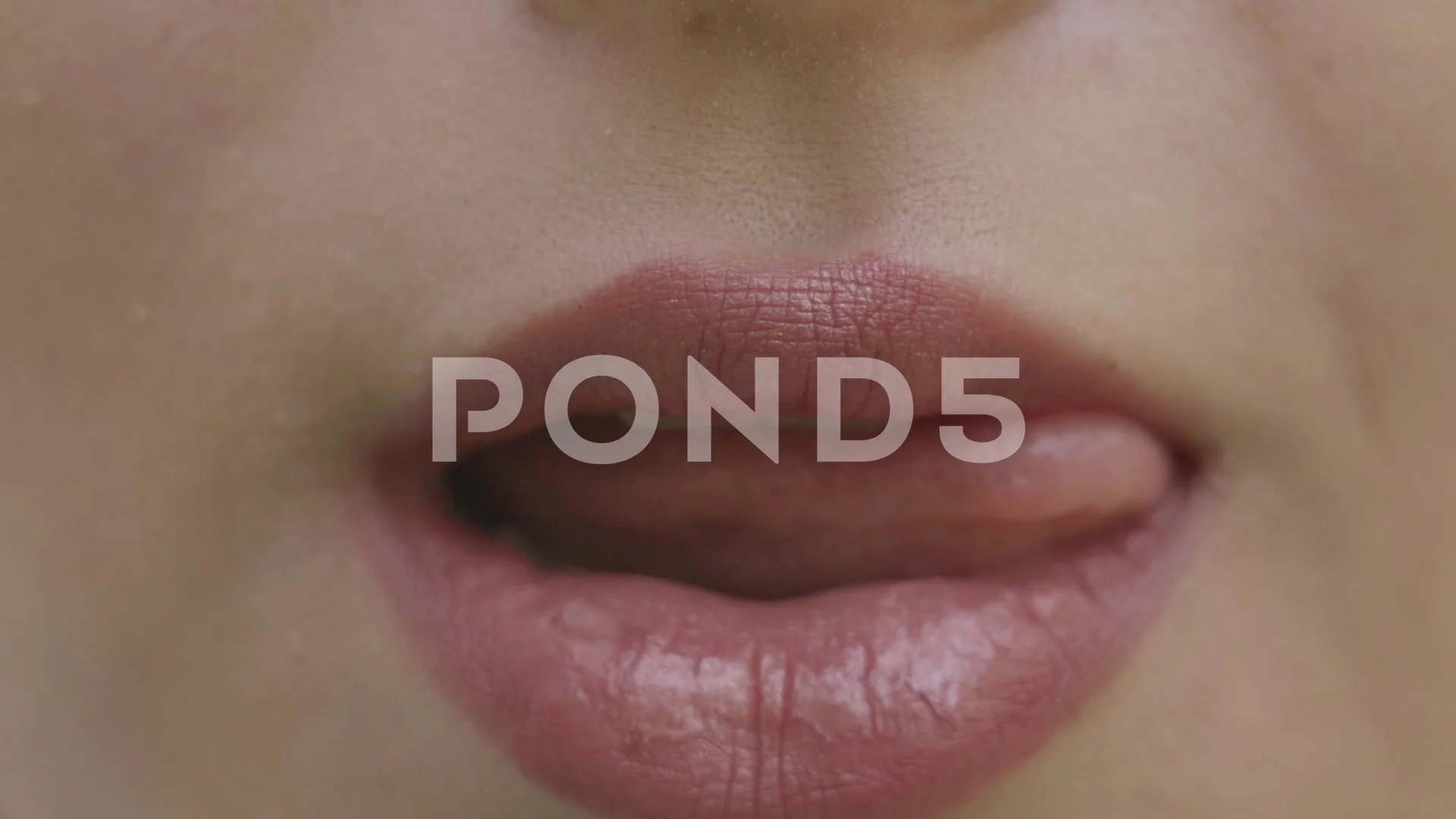 Young woman sexually licks her lips | Stock Video | Pond5