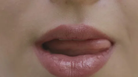 Young woman sexually licks her lips Stock Footage