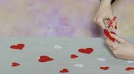 Young Woman Shaped Decorative Hearts With Scissors. St. Valentine Day Theme Stock Footage
