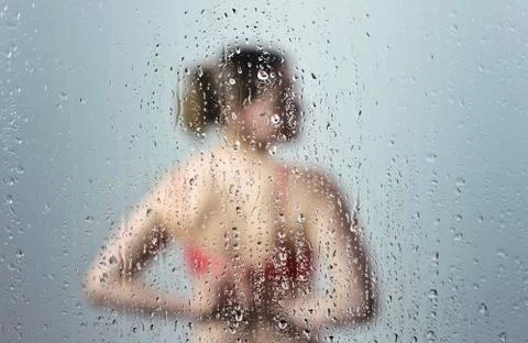 Young woman in shower Stock Photos
