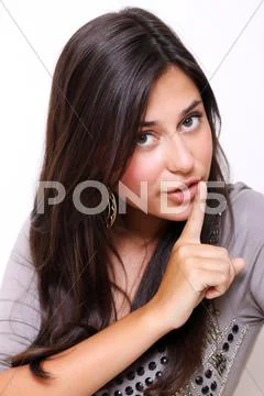 Young woman with silence sign Stock Photos