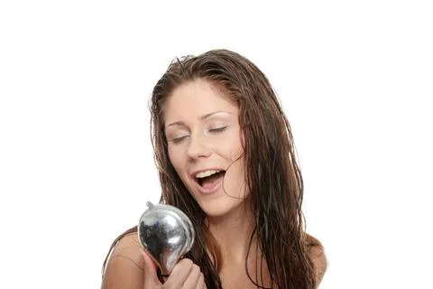 Young woman singing under shower Young woman singing under shower, isolate... Stock Photos