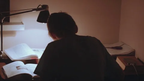 Young woman sitting at the table and work Stock Footage