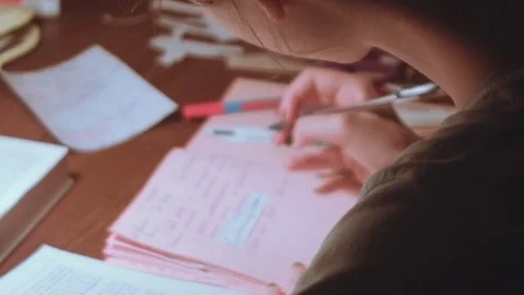 Young woman sitting at the table and work Stock Footage