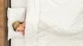 The young woman sleeping on the bad. Time lapse 4k or 4k+ Resolution