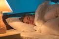 The young woman sleeping on the bed Photo