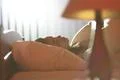 The young woman sleeping on the bed Photo