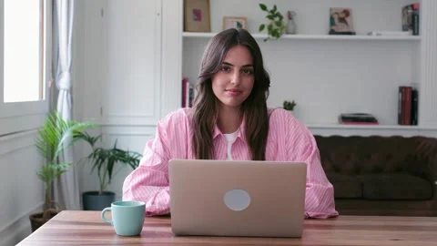 Young Woman Smiling Confidently While Working on Stock-Footage 334015351
