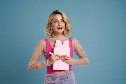 Young woman smiling while posing with stuffed exercise book Stock Photos