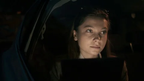 Young Woman Smiling While Using a Tablet Computer Stock Footage 84769188