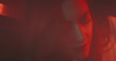 Young  woman smiling while using a vintage projector Stock Footage 203592708