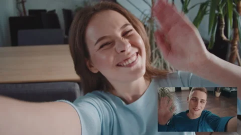 Young woman smiling while video conferene at home during coronavirus self Stock Footage 132169229