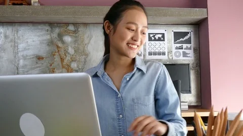 Young woman smiling while working at home Stock Footage 79009748