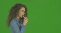 The young woman smoke electronic cigarette on the green background. Real time 4k or 4k+ Resolution
