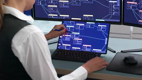 Young Woman Software Developer Uses A Low-code Platform Stockbeeldmateriaal 343880398