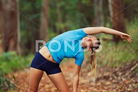 Young woman stretching after workout run Stock Photos