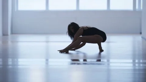 Young Woman Stretching Her Left Leg Stock Footage 71893653