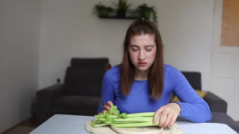 Young woman struggles with restrictive eating and calorie obsession Video stock 341237188
