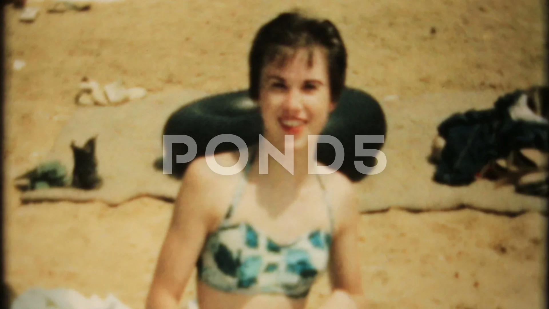 young woman sunbathing at the beach 1950s vintage film home movie 4271