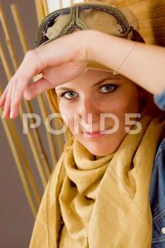 Young woman sunburned face with pilot goggles Stock Photos