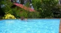 Young Woman in the Swimming Pool. Slow Motion. HD Footage