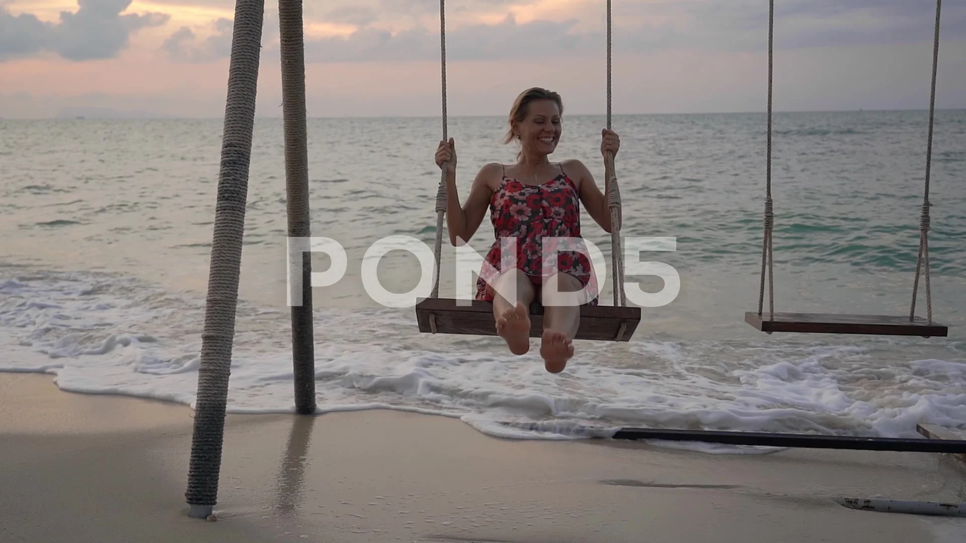https://images.pond5.com/young-woman-swinging-swing-standing-footage-142917799_prevstill.jpeg