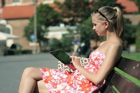 Young woman with tablet computer in the city NTSC Stock Footage