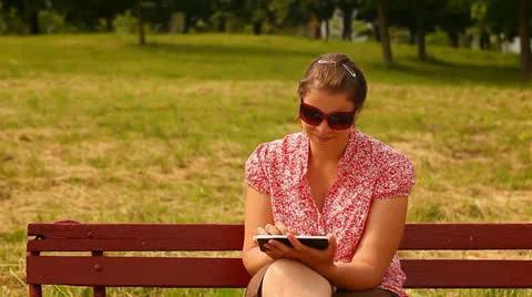 Young woman with tablet computer. smiling and laughing. Stock Footage 24759354