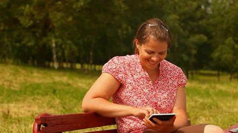 Young woman with tablet computer. smiling and laughing. Stock Footage 24759363