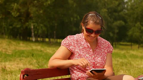 Young woman with tablet computer. smiling and laughing. Stock Footage 24759436