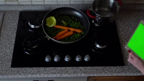 Young woman with tablet computer standing in kitchen. Top view. Green screen. Cl Stock Footage 73531709
