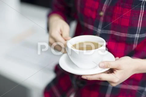 Young woman taking a coffee break Stock Photos