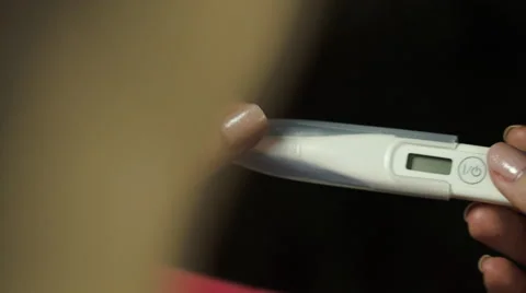 Young Woman Taking Out A Thermometer And Checking It Vídeos de archivo 59559817