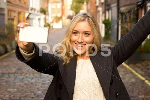 Young woman taking a selfie Stock Photos