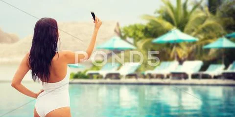 Young woman taking selfie with smartphone Stock Photos