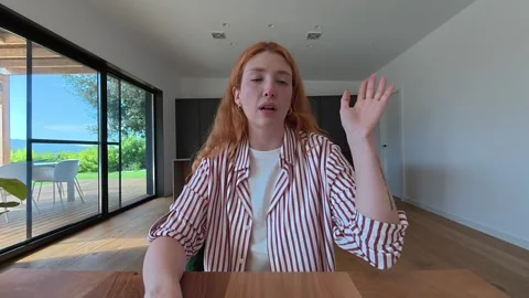 Young woman talking and laughing during video call Stock Footage 333539953