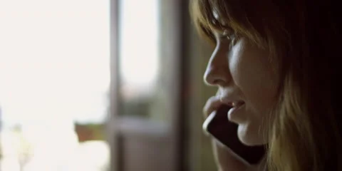 Young woman talking on cell phone Stock Footage