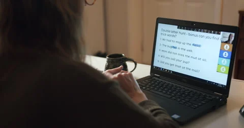 Young woman teaching remote class language and spelling from home on a laptop. Stock Footage 145602083