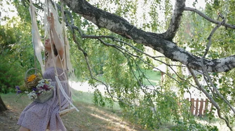 Young woman teeter in the shadow of the tree Stock Footage 60209525