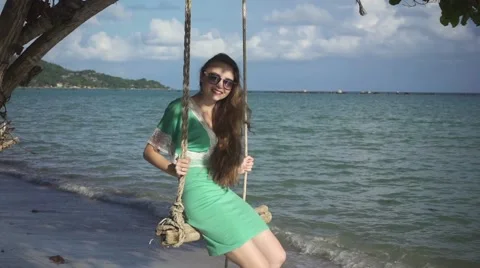 Young Woman Teeters on the Sea Background. Slow Motion Stock Footage 59158227