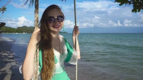 Young Woman Teeters on the Sea Background. Slow Motion Stock Footage 59158281