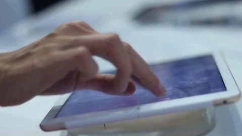 Young woman is testing a modern tablet in the office Stock Footage 87136398