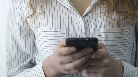 Young woman text messaging with her smartphone Stock Footage 89651034