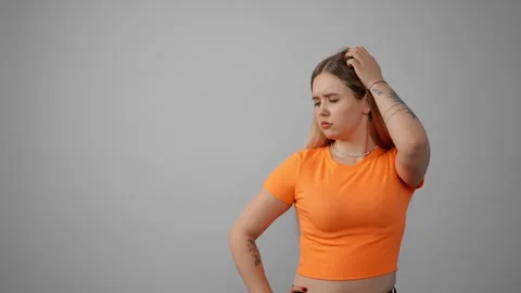 Young woman thinking to solve a problem. Pensive girl thoughtfully at idea hold Stock-Footage 276612943