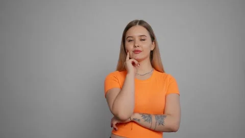 Young woman thinking to solve a problem. Pensive girl thoughtfully at idea hold Stock-Footage 276618157