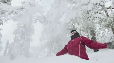 Young woman throwing snow up. slow motion Stock Footage 59778409