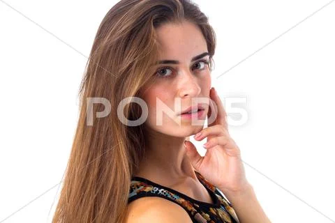 Young woman touching her face Stock Photos