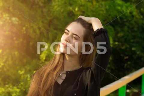 Young woman touching her hair Stock Photos