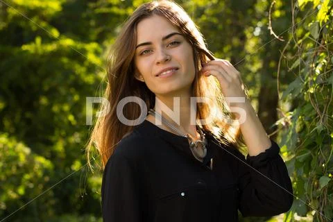 Young woman touching her hair Stock Photos